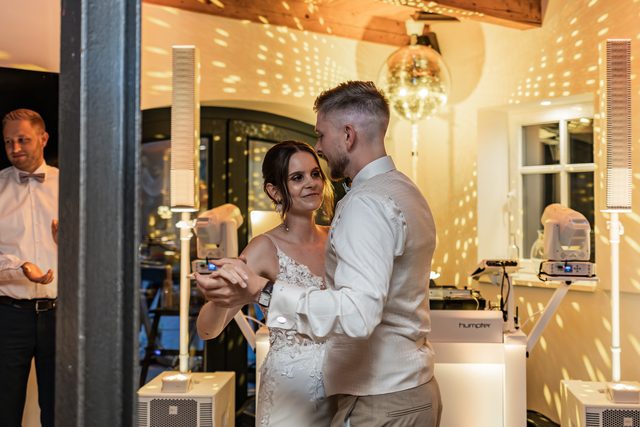 Packed dancefloor under the disco ball on a wedding night